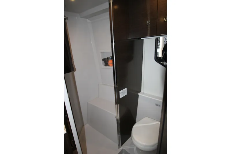 Slide: The Image of 2019 Cruisers Yachts 42 Cantius bathroom interior with modern fixtures and storage. - 43