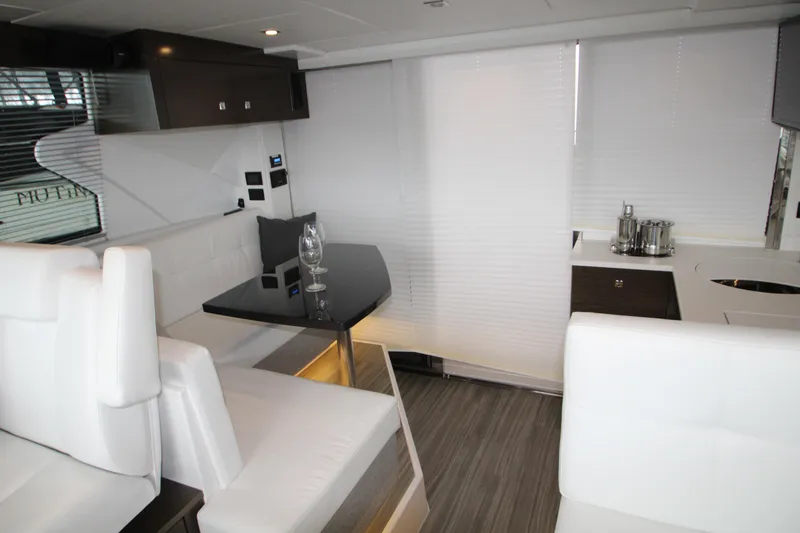Slide: The Image of Luxurious interior of 2019 Cruisers Yachts 42 Cantius with modern seating and dining area. - 52