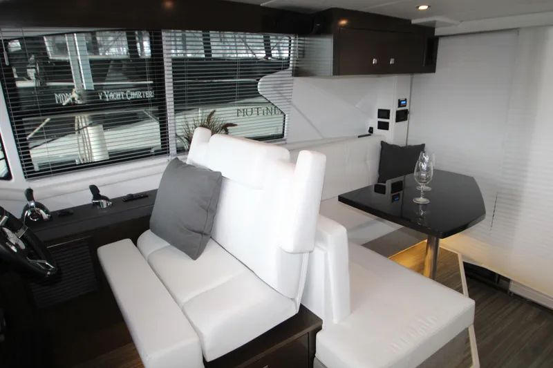 Slide: The Image of Luxurious interior of 2019 Cruisers Yachts 42 Cantius with modern seating and dining area. - 53