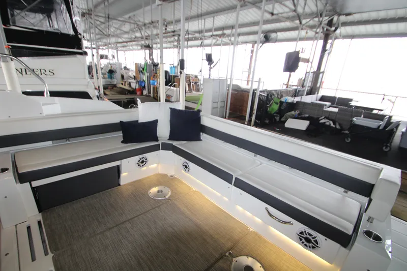 Slide: The Image of 2019 Cruisers Yachts 42 Cantius interior with cushioned seating and ambient lighting. - 73