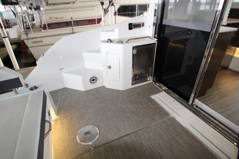 Slide: The Image of 2019 Cruisers Yachts 42 Cantius cockpit with steps, storage, and sleek design. - 75