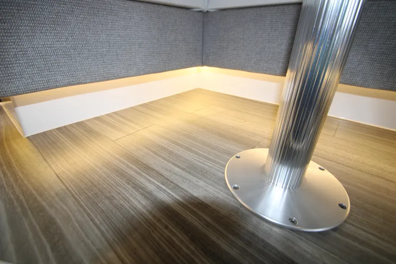 Slide: The Image of 2019 Cruisers Yachts 42 Cantius interior with modern flooring and sleek metal table base. - 80