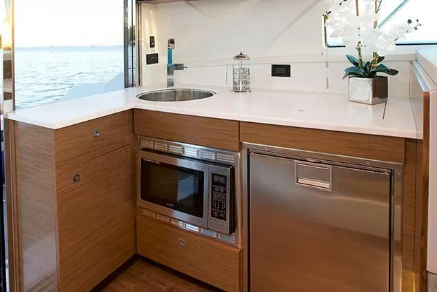 Slide: The Image of 2019 Cruisers Yachts 42 Cantius interior with modern seating and dining area. - 9