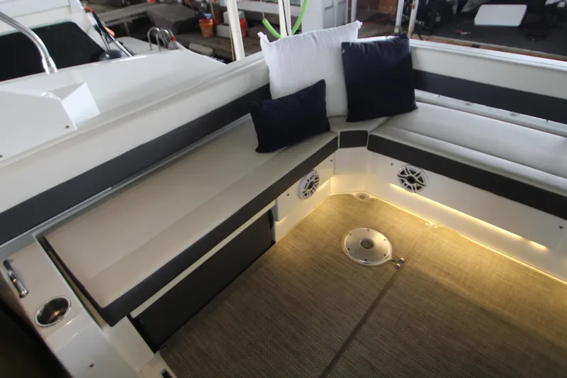 Slide: The Image of 2019 Cruisers Yachts 42 Cantius interior with cushioned seating and ambient lighting. - 90