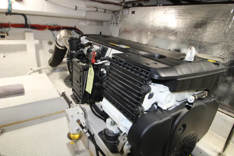 Slide: The Image of Engine room of 2019 Cruisers Yachts 42 Cantius, showcasing a powerful marine engine. - 92
