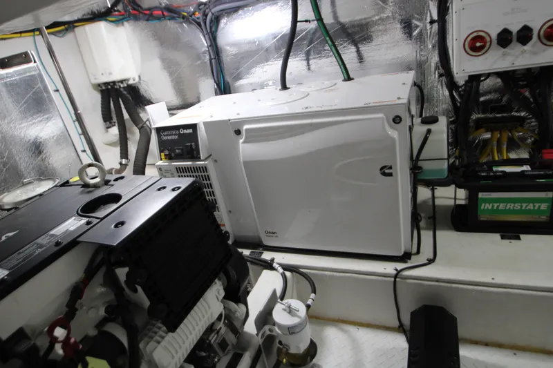 Slide: The Image of Engine room of 2019 Cruisers Yachts 42 Cantius with Cummins Onan generator. - 93