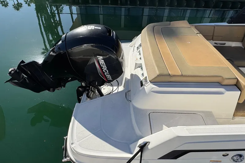 Slide: The Image of 2022 Bayliner VR6 Bowrider OB with Mercury outboard engine on calm water. - 12