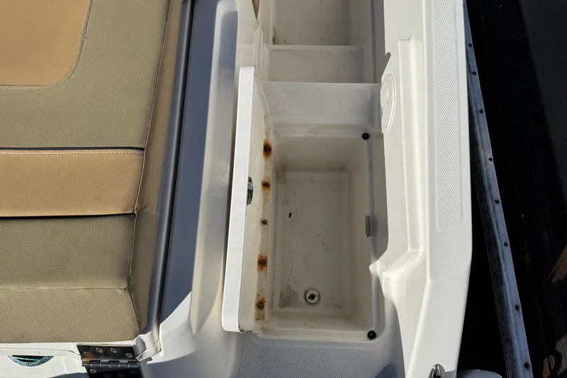 Slide: The Image of 2022 Bayliner VR6 Bowrider OB with tan seating, docked by the water. - 15