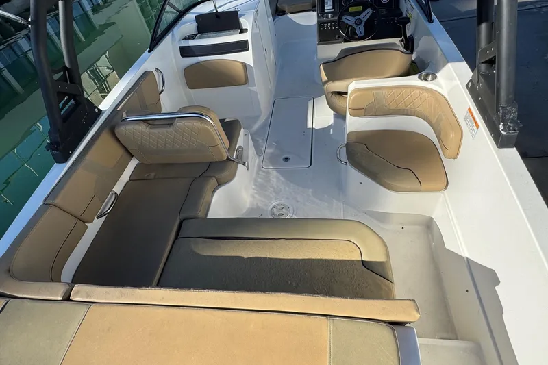 Slide: The Image of 2022 Bayliner VR6 Bowrider OB deck with storage compartment and seating. - 16