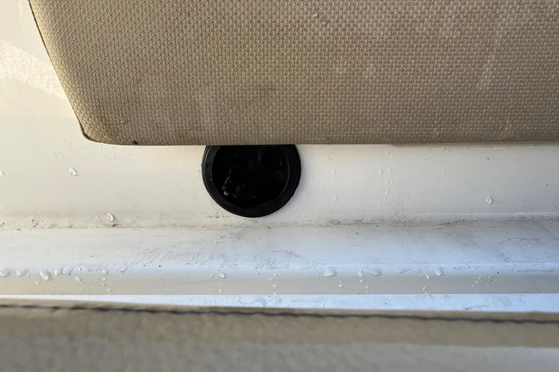 Slide: The Image of 2022 Bayliner VR6 Bowrider OB interior with tan seating and sleek design. - 23