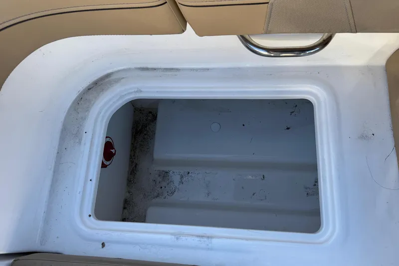 Slide: The Image of 2022 Bayliner VR6 Bowrider OB interior with tan seating and modern design. - 24