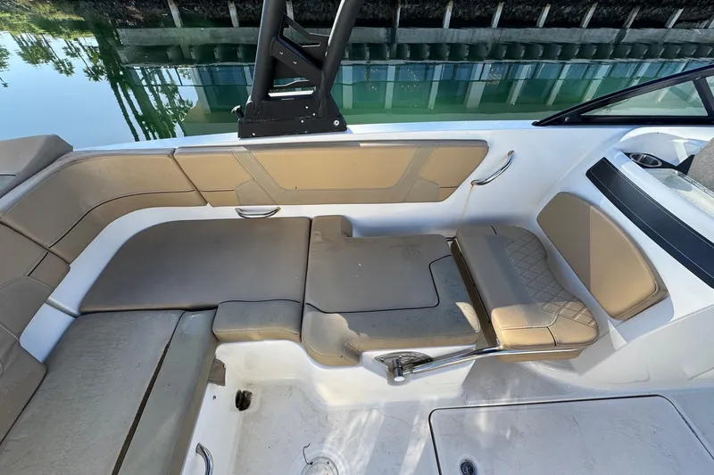 Slide: The Image of 2022 Bayliner VR6 Bowrider OB boat interior with open storage compartment. - 26
