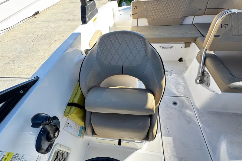 Slide: The Image of 2022 Bayliner VR6 Bowrider OB interior with tan seating and storage compartment. - 31