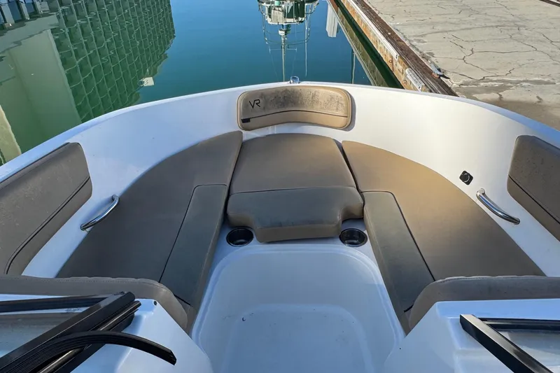 Slide: The Image of 2022 Bayliner VR6 Bowrider OB dashboard with controls and warning labels. - 37