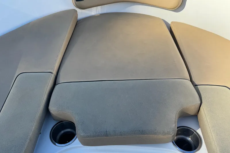 Slide: The Image of 2022 Bayliner VR6 Bowrider OB interior with tan seating and sleek dashboard design. - 40