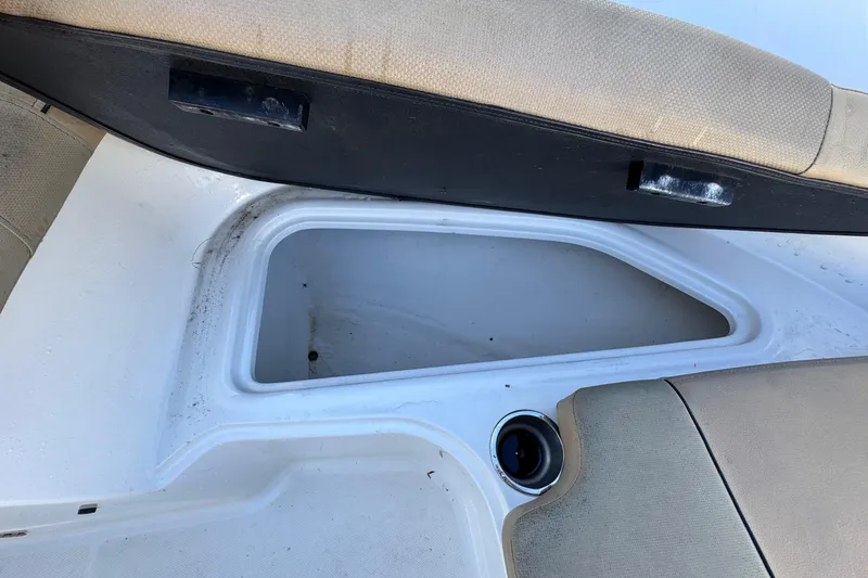 Slide: The Image of 2022 Bayliner VR6 Bowrider OB storage compartment with red life jackets inside. - 41