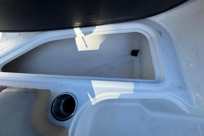 Slide: The Image of 2022 Bayliner VR6 Bowrider OB storage compartment with red life jackets. - 42