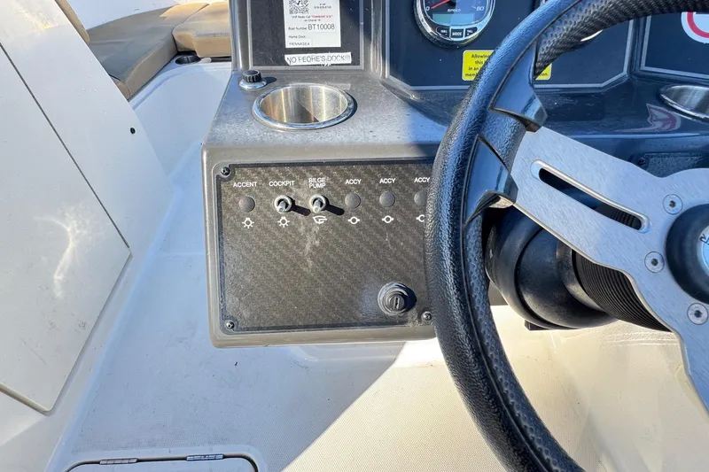 Slide: The Image of 2022 Bayliner VR6 Bowrider OB at marina, featuring spacious bow seating and sleek design. - 46