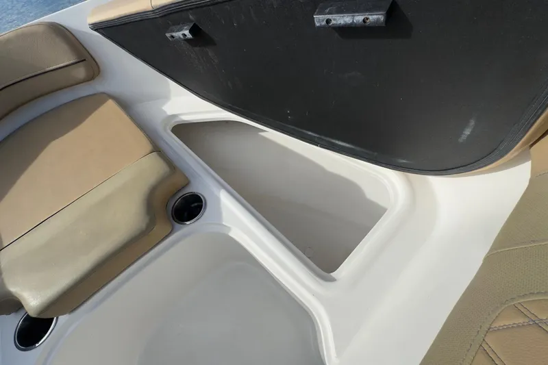 Slide: The Image of 2022 Bayliner VR6 Bowrider OB interior storage compartment with tan seating. - 49
