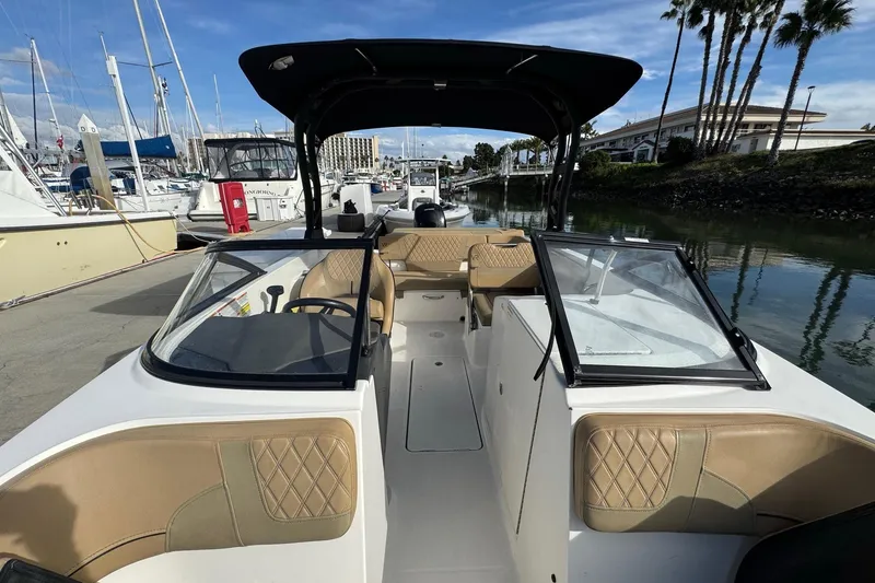Slide: The Image of 2022 Bayliner VR6 Bowrider OB docked, featuring spacious seating and sleek design. - 50