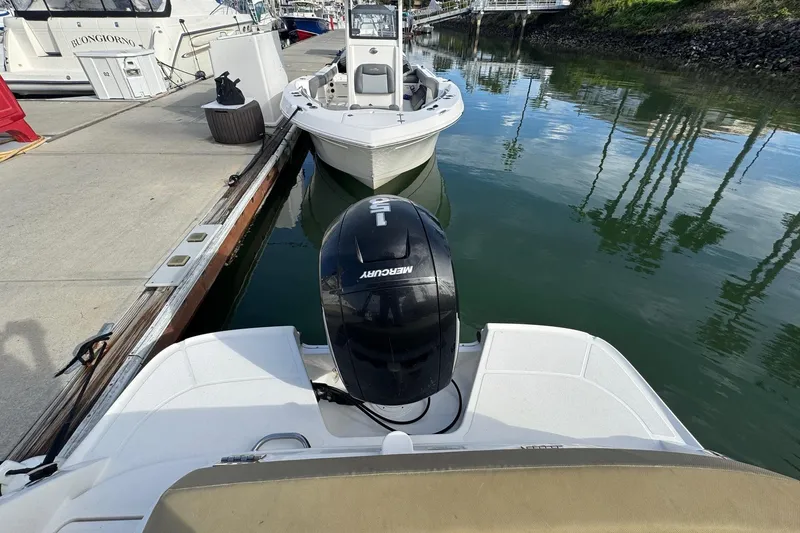 Slide: The Image of 2022 Bayliner VR6 Bowrider OB with Mercury outboard engine docked at marina. - 51