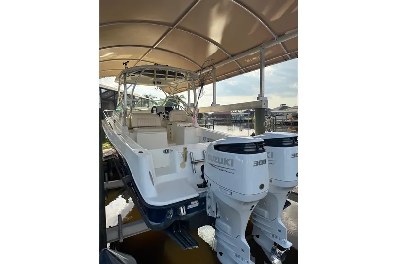 Slide: The Image of 2006 Hydra-Sports Vector 2900 VX cruising at sunset on a calm waterway. - 1