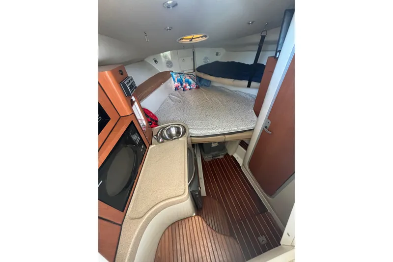 Slide: The Image of 2006 Hydra-Sports Vector 2900 VX boat bathroom interior with toilet and storage. - 10