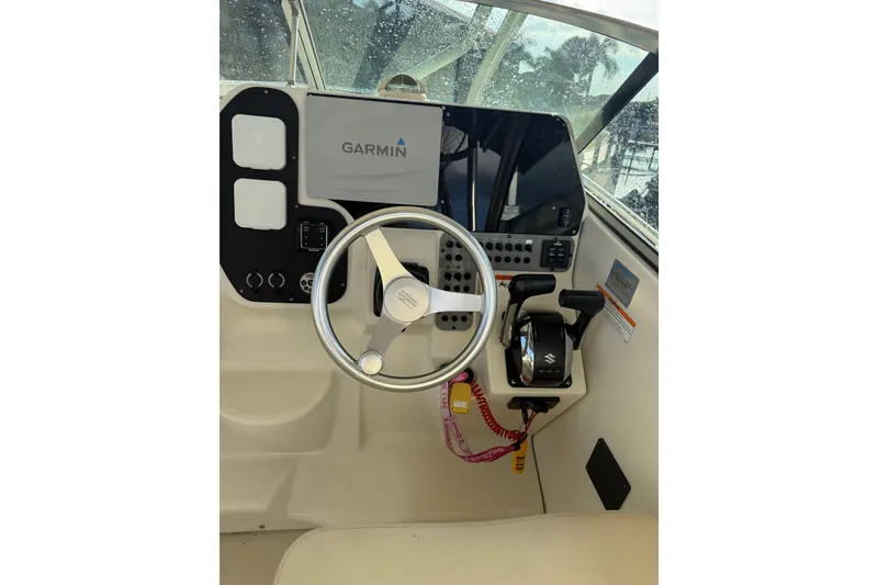 Slide: The Image of 2006 Hydra-Sports Vector 2900 VX boat interior with seating and window view. - 5