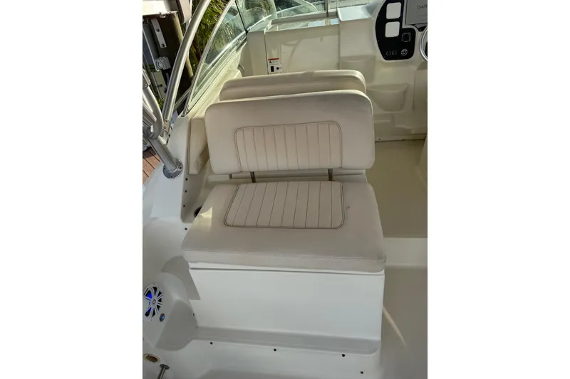 Slide: The Image of 2006 Hydra-Sports Vector 2900 VX boat with twin Suzuki 300 engines docked under canopy. - 6