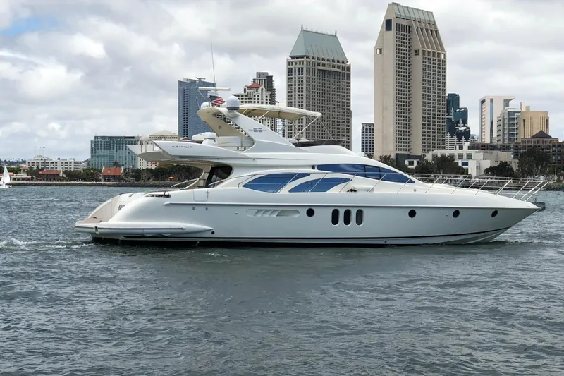 The Image of Luxury 2007 Azimut 62 Evolution yacht cruising near city skyline. - 0