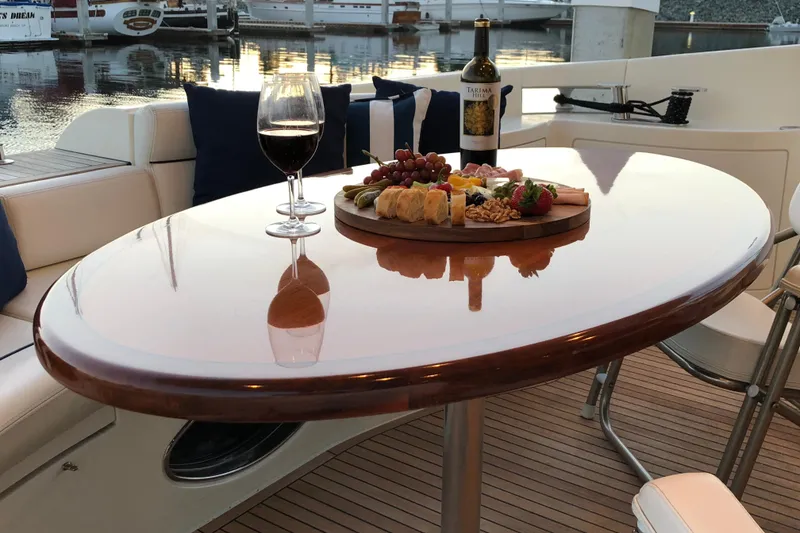 Slide: The Image of Luxurious dining setup on 2007 Azimut 62 Evolution yacht with wine and charcuterie board. - 13