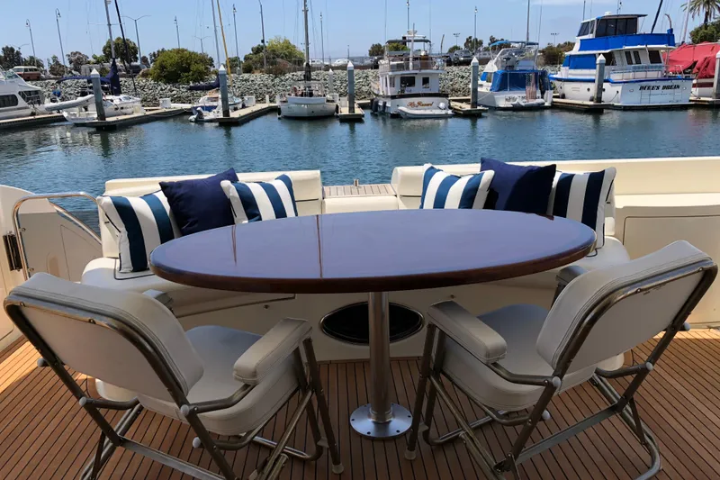 Slide: The Image of Luxury yacht Azimut 62 Evolution 2007, featuring elegant outdoor seating with marina view. - 17
