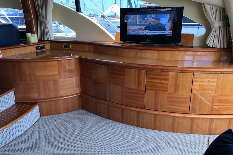 Slide: The Image of Luxurious interior of 2007 Azimut 62 Evolution yacht with wood paneling and TV. - 2