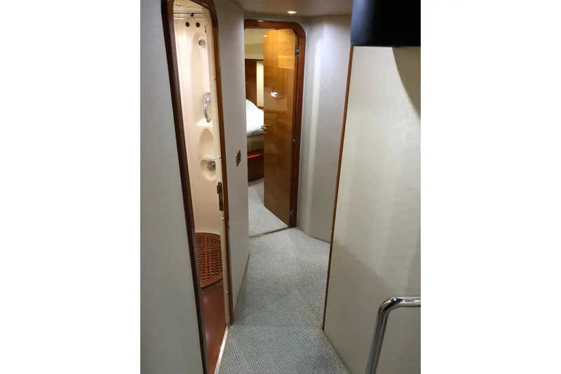 Slide: The Image of Interior hallway of 2007 Azimut 62 Evolution yacht, featuring elegant wood and carpeted flooring. - 20