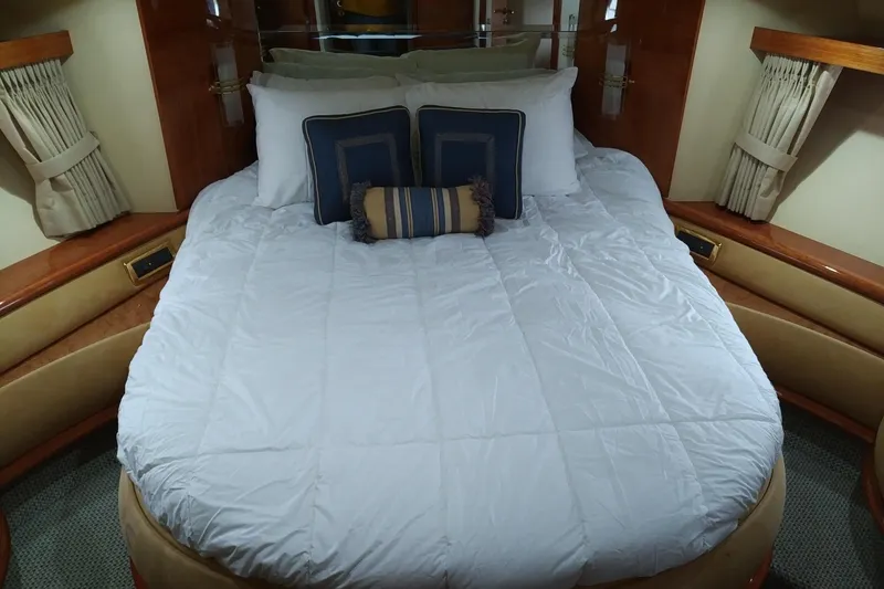 Slide: The Image of Luxurious bedroom interior of 2007 Azimut 62 Evolution yacht with plush bedding. - 24