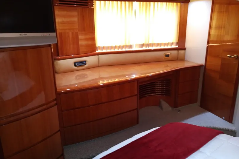 Slide: The Image of Luxurious interior of 2007 Azimut 62 Evolution yacht with polished wood finish. - 25