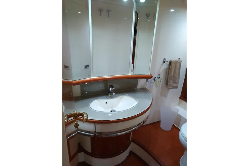 Slide: The Image of Luxurious bathroom in 2007 Azimut 62 Evolution yacht with elegant fixtures and wood accents. - 27