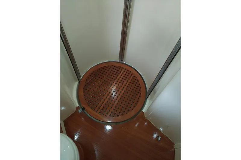 Slide: The Image of Shower area in 2007 Azimut 62 Evolution yacht with wooden floor detail. - 28