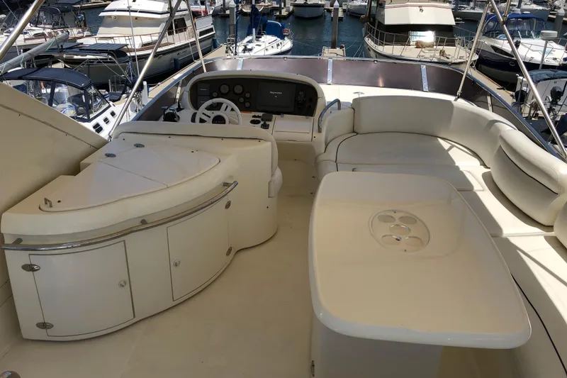 Slide: The Image of Luxurious 2007 Azimut 62 Evolution yacht interior with helm and seating area. - 34