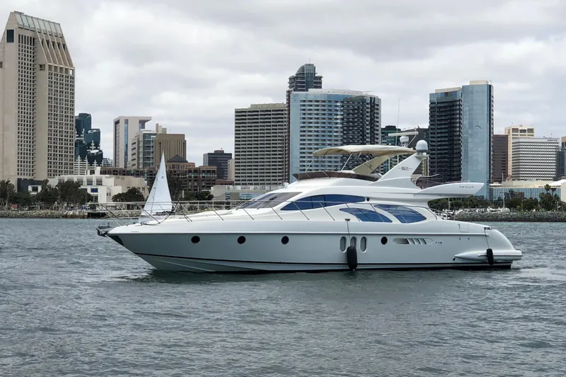 Slide: The Image of Luxury 2007 Azimut 62 Evolution yacht cruising near city skyline. - 37