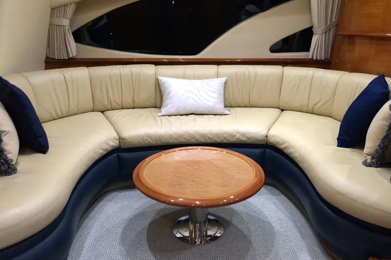 Slide: The Image of Luxurious interior of 2007 Azimut 62 Evolution yacht with elegant seating and table. - 5