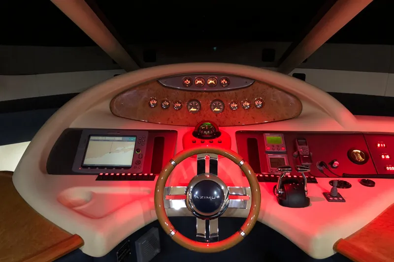 Slide: The Image of 2007 Azimut 62 Evolution yacht helm with illuminated controls and navigation equipment. - 8