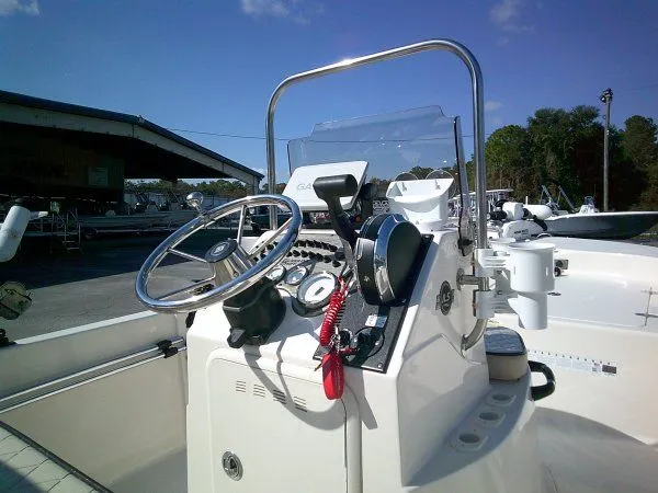Slide: The Image of 2022 Carolina Skiff JLS 178 boat console with steering wheel and controls. - 5