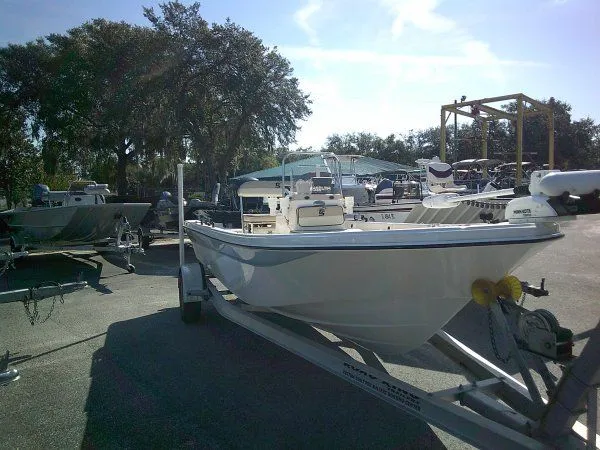 Slide: The Image of 2022 Carolina Skiff JLS 178 boat on trailer in outdoor marina setting. - 7
