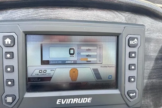 Slide: The Image of Evinrude boat dashboard display on a 2015 Bennington 2350 QCL, showing engine and fuel data. - 18