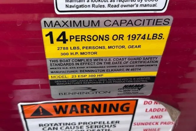 Slide: The Image of 2015 Bennington 2350 QCL capacity label: 14 persons, 1974 lbs, 300 HP motor. - 24