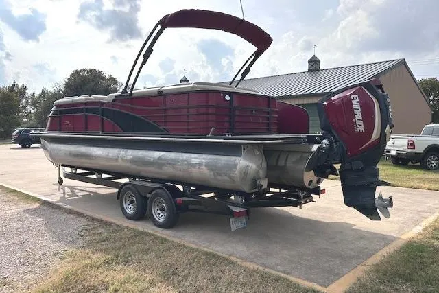 Slide: The Image of 2015 Bennington 2350 QCL pontoon boat on trailer with Evinrude outboard motor. - 5