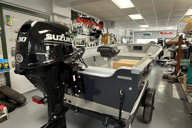 Slide: The Image of 2026 Lund Fury 1600 Tiller boat with Suzuki 30 horsepower engine in showroom. - 5