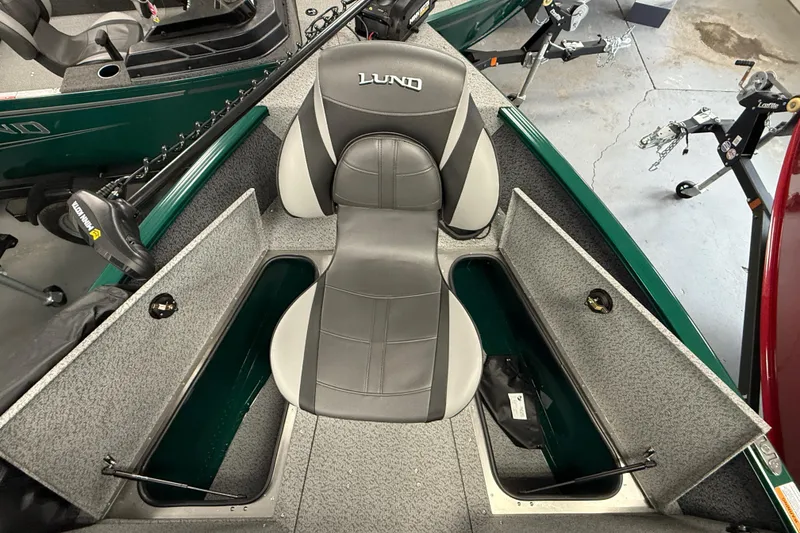 Slide: The Image of 2026 Lund 1775 Adventure Sport boat interior with storage compartments and seating. - 10