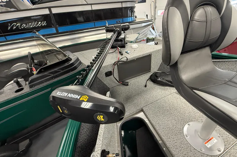 Slide: The Image of 2026 Lund 1775 Adventure Sport boat interior with Minn Kota trolling motor and seating. - 11